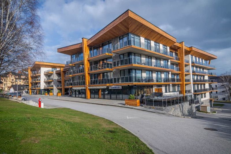 Recreational apartment in Starý Smokovec with glass balconies and wooden decor.