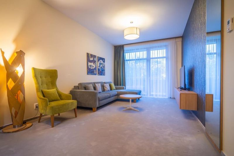 A stylish living area with a comfortable sofa set in the Holiday Apartment.