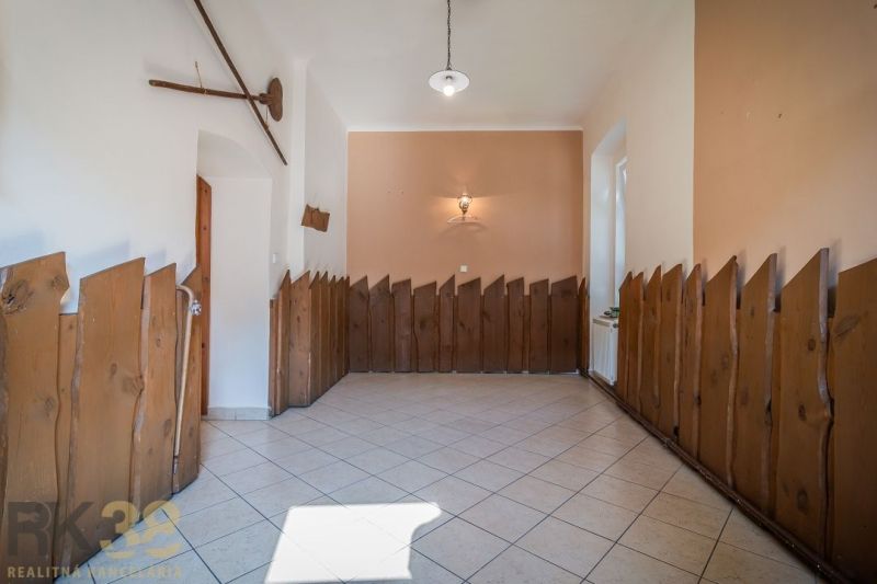 Interior of gastronomic spaces with wooden paneling and tiles.