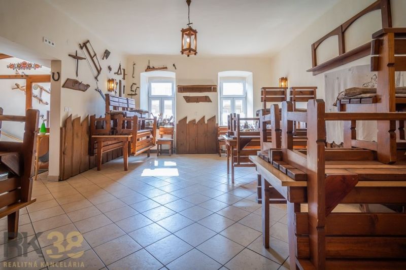 Interior of dining spaces with wooden furniture and themed decorations on the walls.