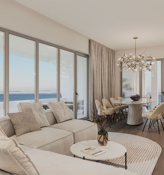 A spacious living room with large windows and a wooden decor floor is part of the 4-room apartment.