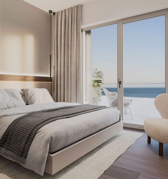 Bedroom with a bed in a 4-room apartment, with a sea view, wooden decor flooring.
