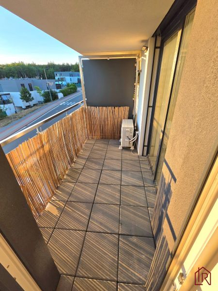 The balcony of a 2-room apartment on Pod hájom Street, Košice - Lorinčík district, with tiles and a shade.
