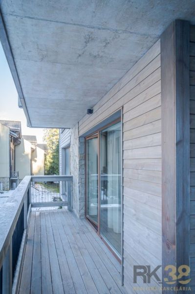Balcony of a recreational apartment in Demänovská Dolina with a wooden decor floor.