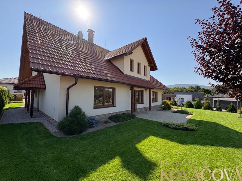 A family house in Trenčianska Turná with a sloped roof and a well-maintained garden.