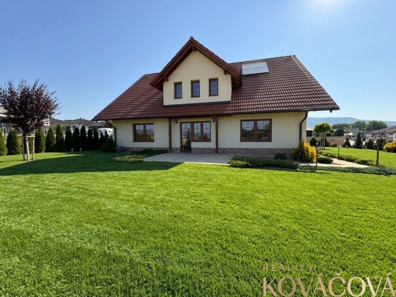 A family house in Trenčianska Turná with a spacious garden and a well-maintained lawn.