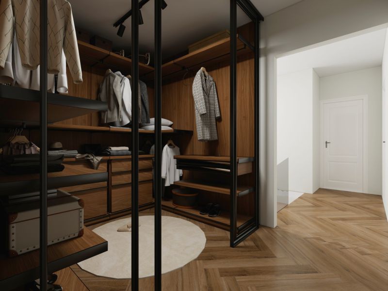 A wardrobe in a family house with shelves, mirrored doors, and a wooden decor floor.