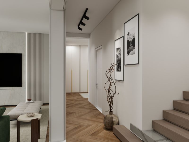 Interior of a family house with a wood-decorated floor, stairs, and art paintings.