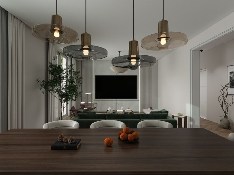 Dining room in a family house with a wooden table, pendant lights, and a view of the living room.