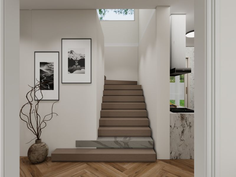 A staircase in a family house with a wooden decor floor and modern photographs on the wall.