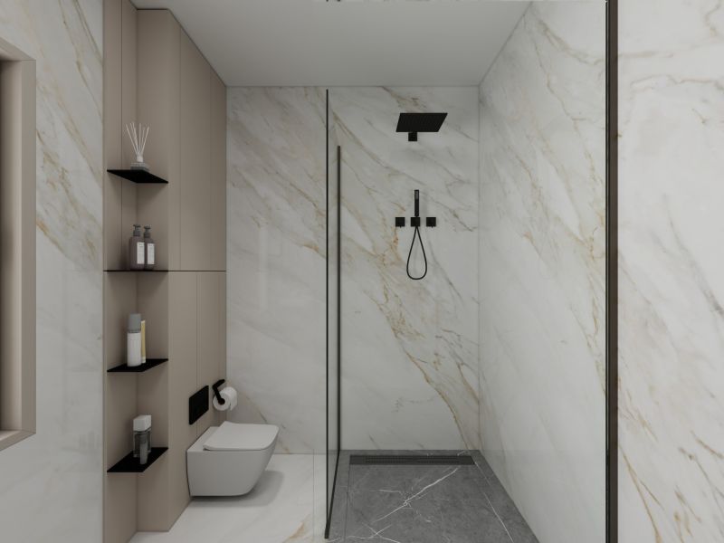 A bathroom in a family house with elegant tiles and a shower enclosure.