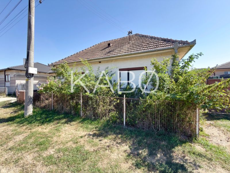 A family house in Hruboňovo with a fenced front garden and a gable roof.