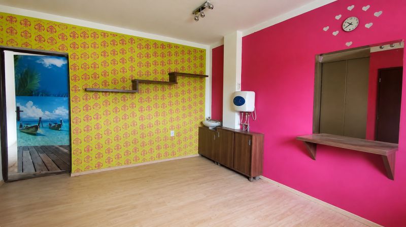 Colorful walls and a wooden decor floor in a family house.