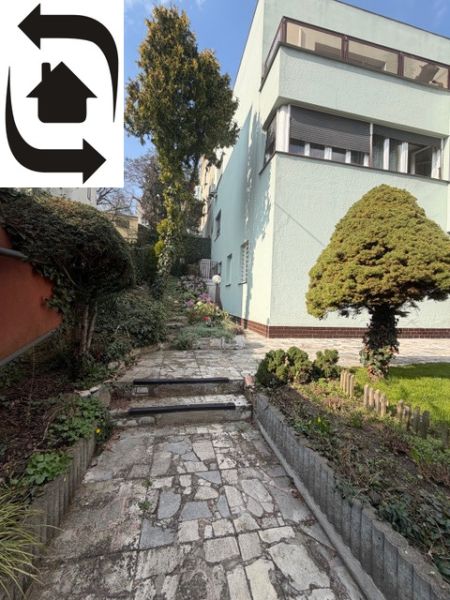 Garden at the villa on Bradlianska Street, Bratislava - Old Town, with a stone path.
