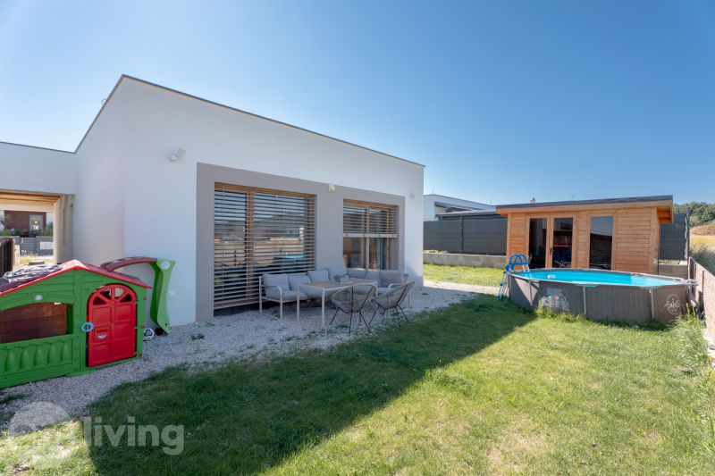 A family house in Trenčianske Jastrabie with a garden, swimming pool, children's playhouse, and terrace.