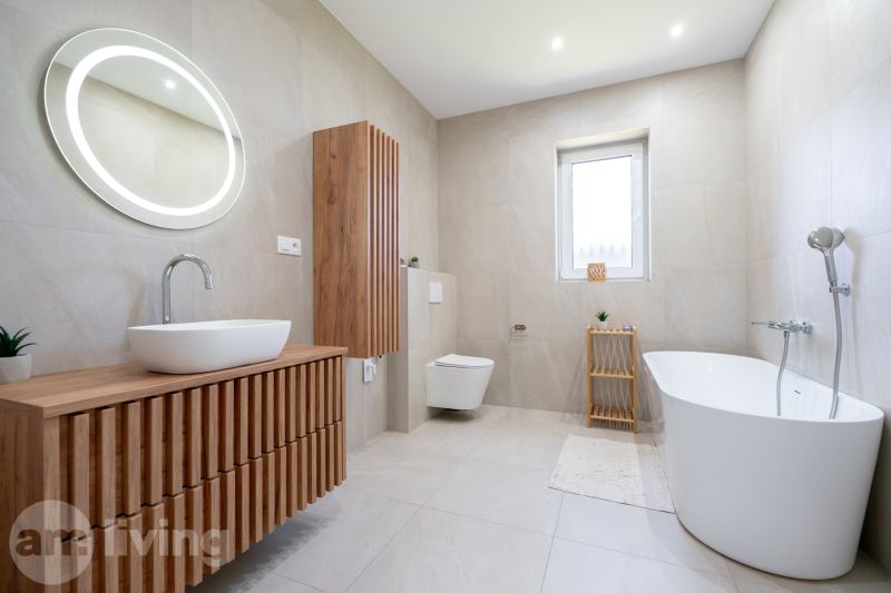 A bathroom in a family house with a bathtub, a wall-hung toilet, and wooden decor furniture.