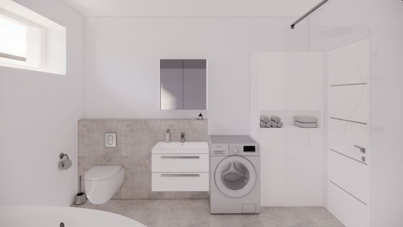 Bathroom in a family house with a washing machine, a shower, and storage space.
