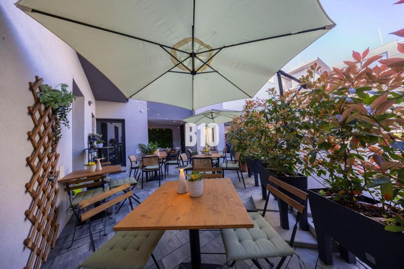 Furnished terrace of gastro premises in Bratislava - Old Town with seating and umbrellas.