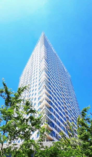 A high-rise building on Landererova Street in Bratislava - Staré Mesto under a blue sky.