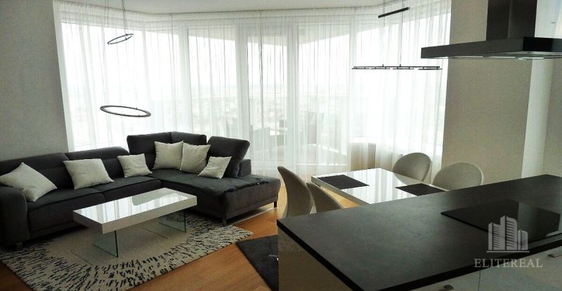 Living room with a corner sofa and a dining table in a 3-room apartment.