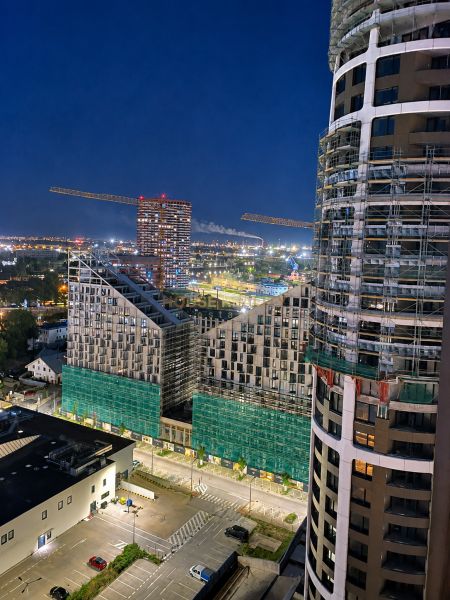 Night view of construction buildings and cranes in Bratislava - Staré Mesto on Továrenská.