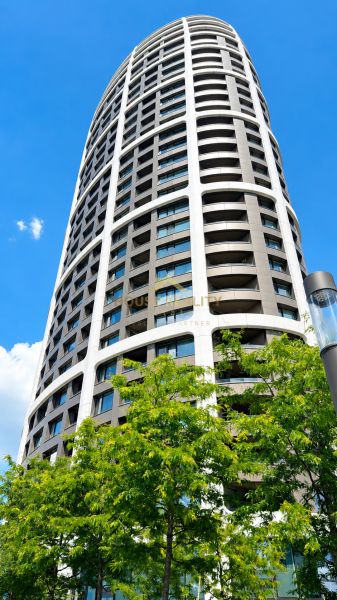 A high-rise building on Továrenská Street in Bratislava - Staré Mesto surrounded by greenery.