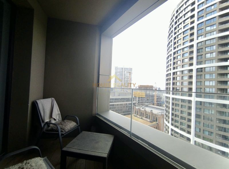 A balcony with a view of modern architecture from a 2-room apartment on Továrenská Street, Bratislava - Staré Mesto.