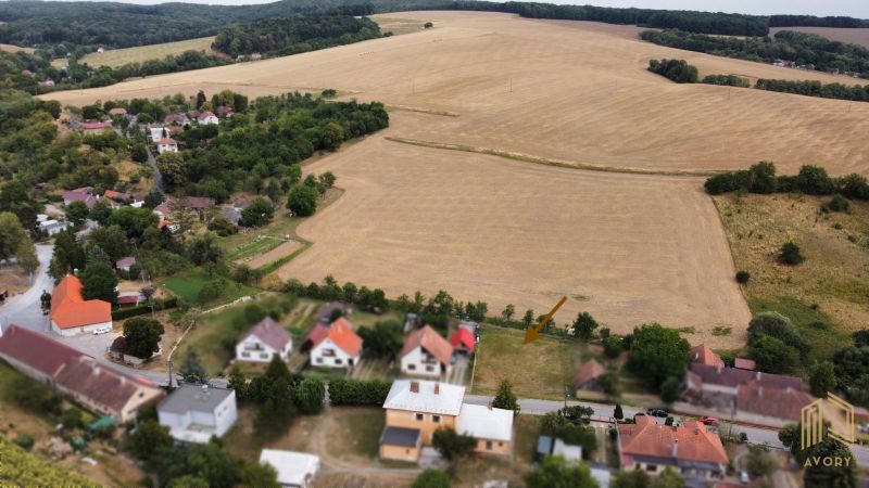 Aerial view of properties - housing in Podbranč surrounded by fields and greenery.