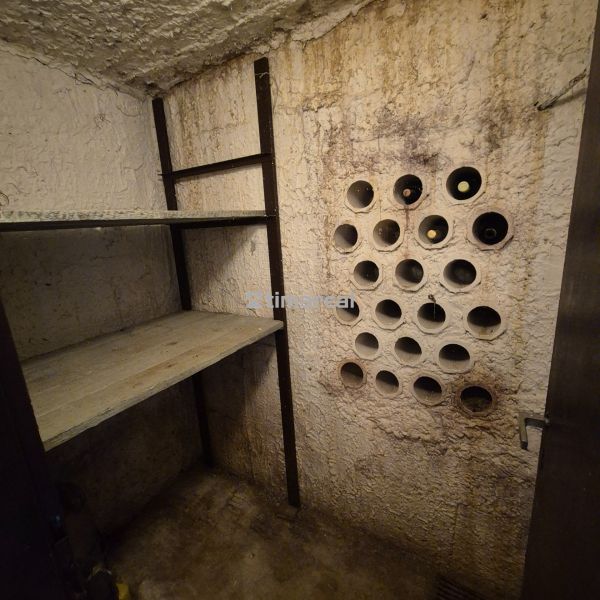 Wine cellar and rack in the cottage basement.
