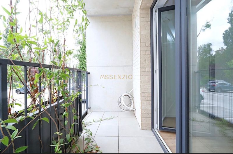 A balcony with plants in a studio apartment, opening to the exterior of Bratislava - Rača.