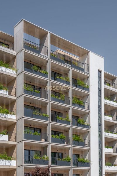 Apartment building with plants on balconies in Bratislava - Rača, exterior of the building.
