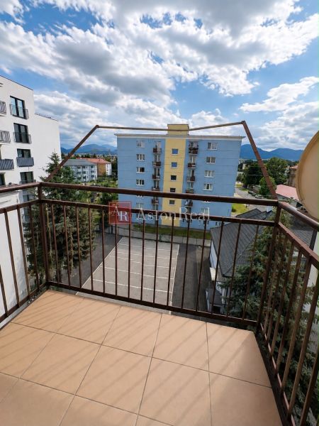 A view from the balcony on Hurbanova Street in Liptovský Mikuláš overlooking the surroundings.