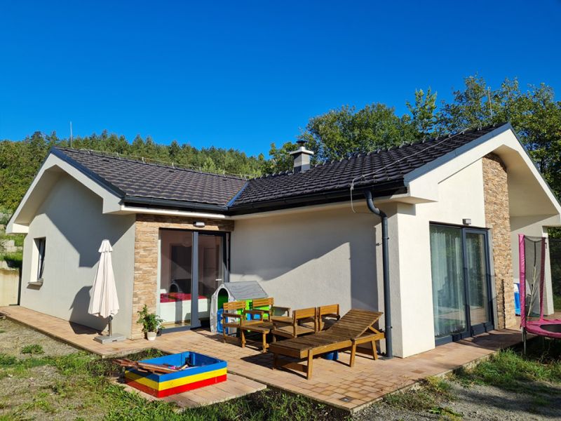 A family house on Zadarska Street in Banska Bystrica with a terrace and a children's playground.