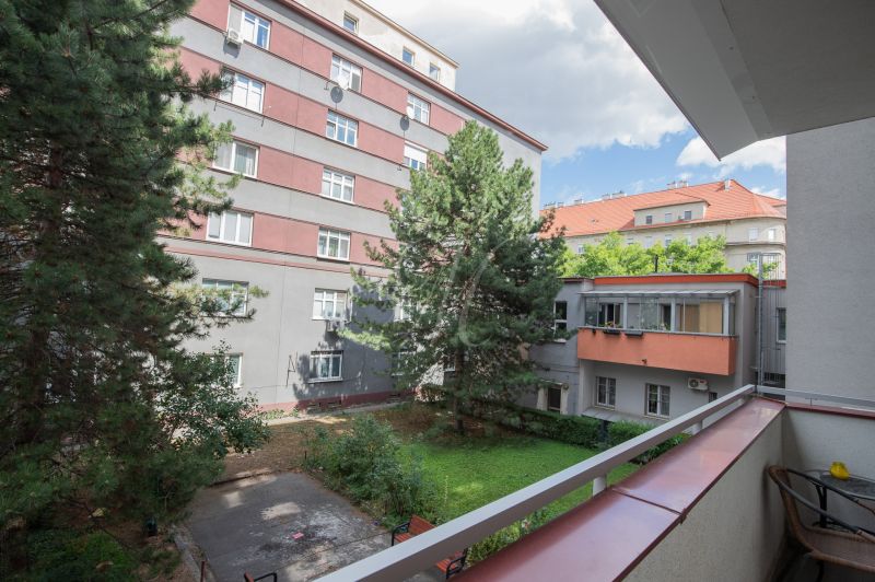 View from the balcony, residential building among trees on Škultétyho Street in Bratislava - Nové Mesto.