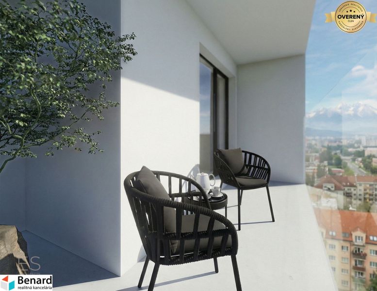 A balcony with a view of Poprad, part of a 3-room apartment; chairs, a table, and a plant.