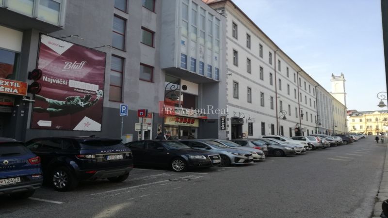 Commercial premises on Kapitulská Street in Banská Bystrica with parking and historic architecture.