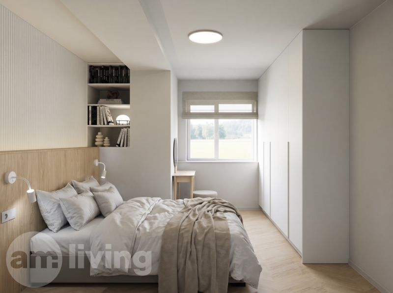 A bedroom with wood-patterned flooring, a bed, and built-in cabinets in a 2-room apartment.