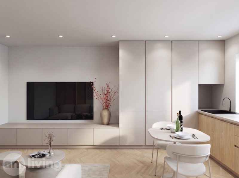 Living room in a two-room apartment, with a TV, dining table, and wooden decor flooring.