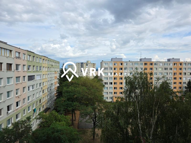 Apartment buildings among trees on Kysucká Street in Košice - West district.