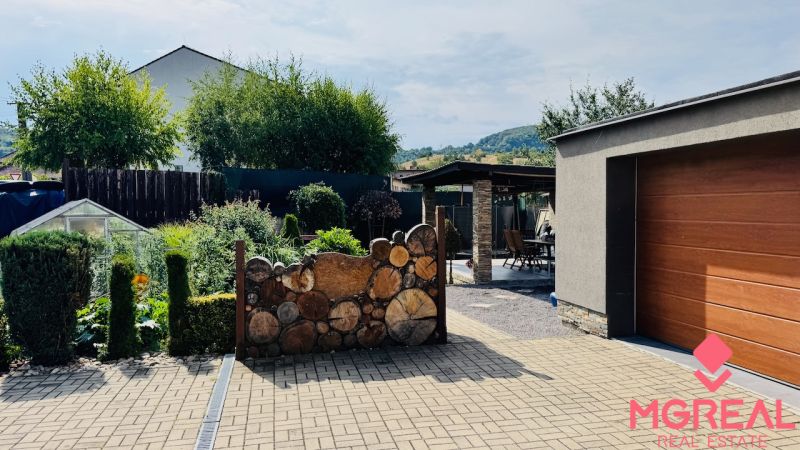 A family house in Radobica with a modern terrace, garage, and landscaped garden.