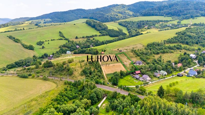 Residential plots at Strelenka in Lysá pod Makytou, surrounded by greenery and hills.