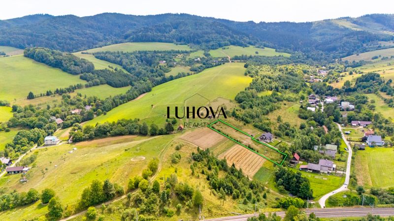 Residential plots in Lysá pod Makytou on Strelenka Street, surrounded by greenery and hills.