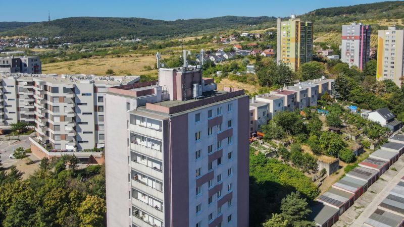 A view of residential buildings in Bratislava - Rača near Sadmelijská Street surrounded by greenery.