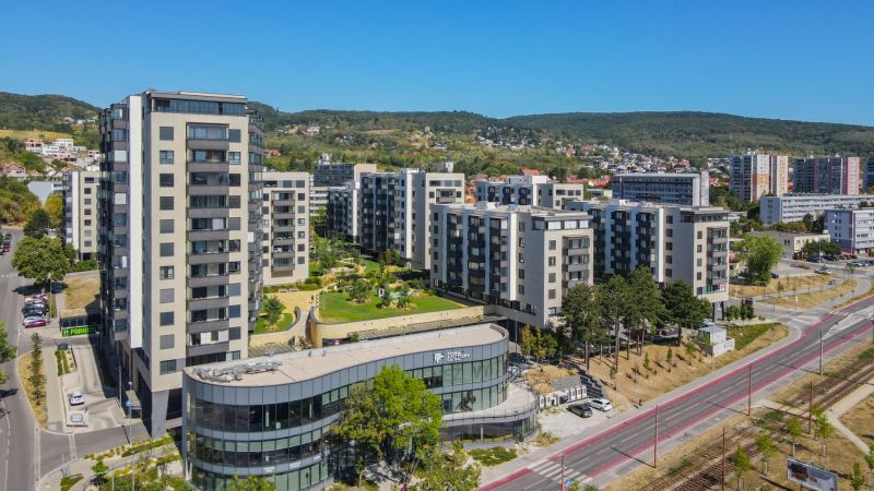 In Bratislava - Rača on Sadmelijská Street, you can see apartment complexes and greenery in the background.