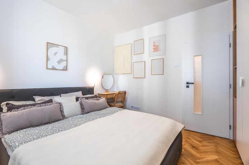 A comfortable bedroom with a bed, an armchair, and decorations, a 3-room apartment.