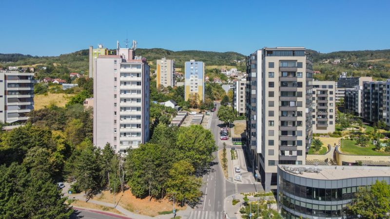 The view of the apartment buildings and greenery on Sadmelijská in Bratislava - Rača offers housing options.
