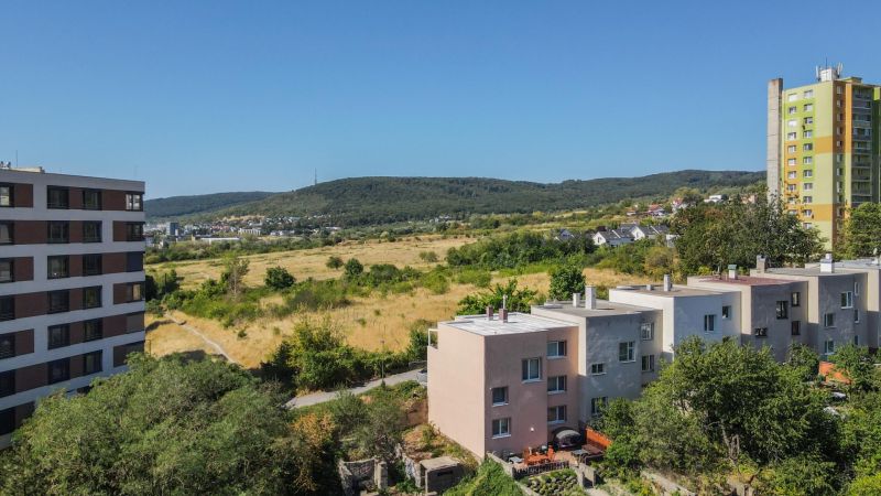 View of the landscape and residential buildings in Bratislava-Rača on Sadmelijská Street.