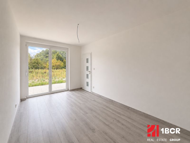 Interior with wood decor flooring and large windows in a family house.