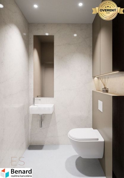 A minimalist bathroom with a simple sink and toilet in a 3-room apartment.