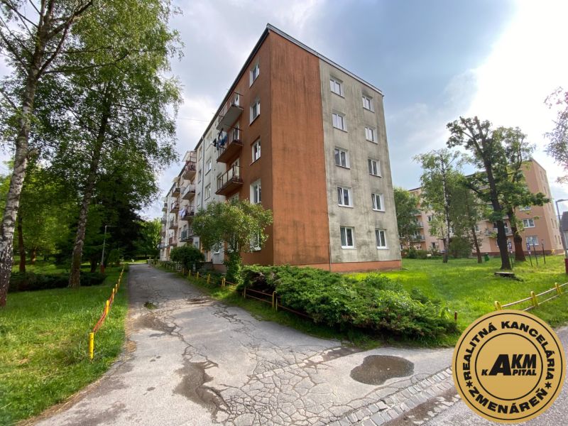 Apartment building on Mierova Street in Čadca, surrounded by greenery and a sidewalk.